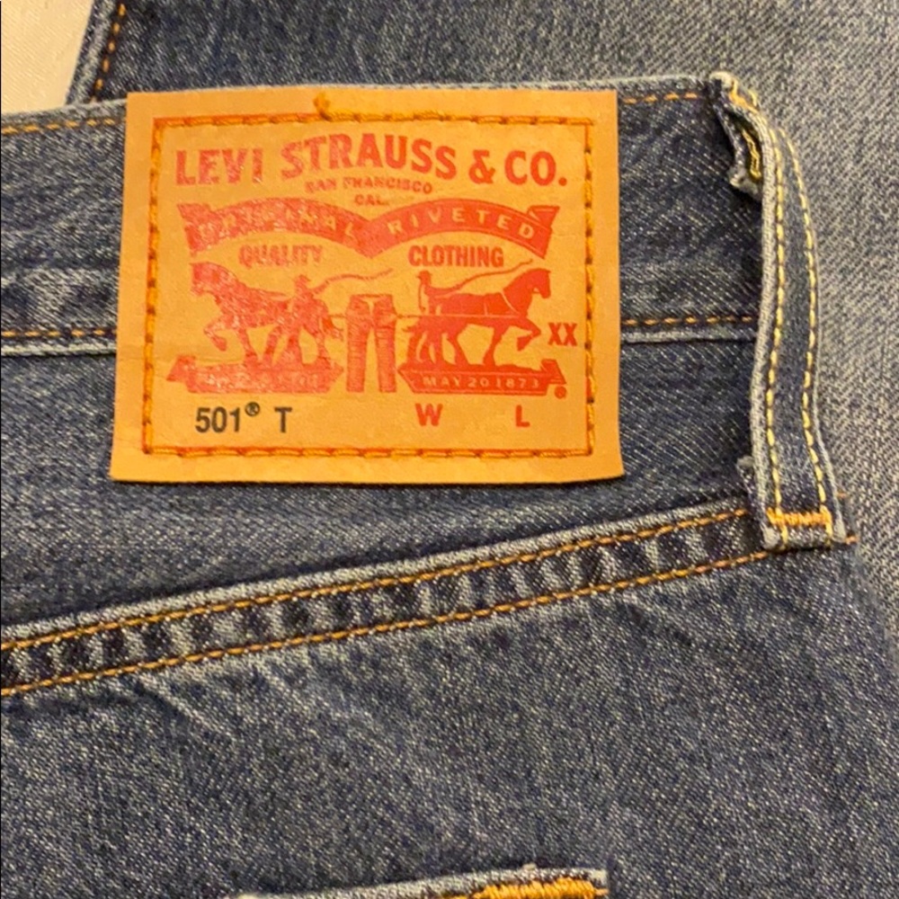 Levi 501 distressed ankle jeans